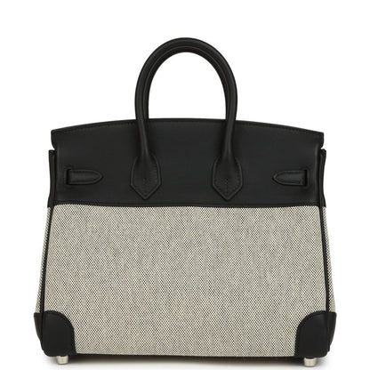 Black leather and cream canvas Hermes Birkin 25 handbag front with top handles.