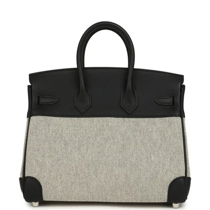 Black leather and cream canvas Hermes Birkin 25 handbag front with top handles.