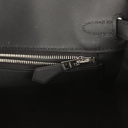 Black leather Hermes Birkin 25 interior pocket with zipper and leather tab pull.