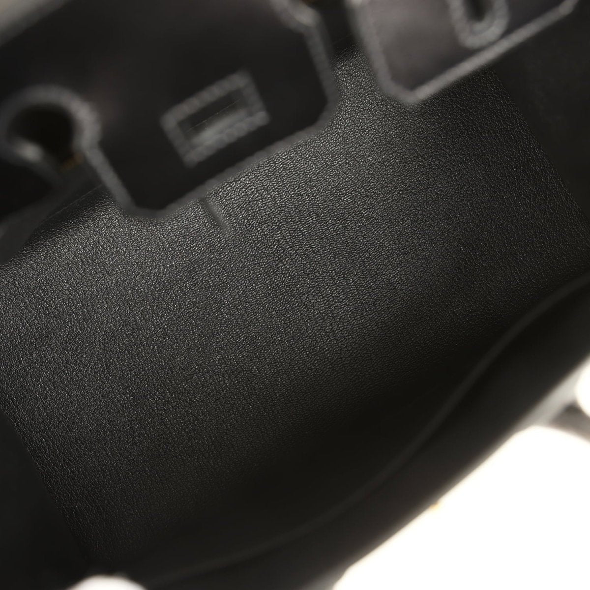 Black Birkin handbag panel with fine-grain leather texture