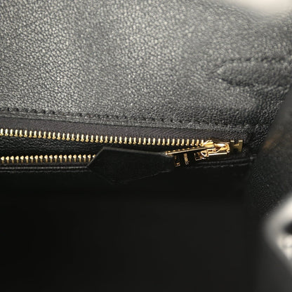 Black leather Birkin handbag with gold-tone zipper and pull tab