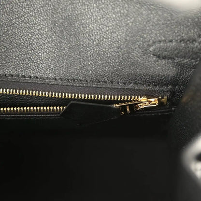 Black leather Birkin handbag with gold-tone zipper and pull tab