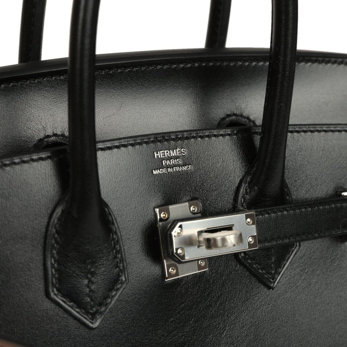 Hermès Birkin Sellier 25 handbag close-up, logo front plate with palladium hardware