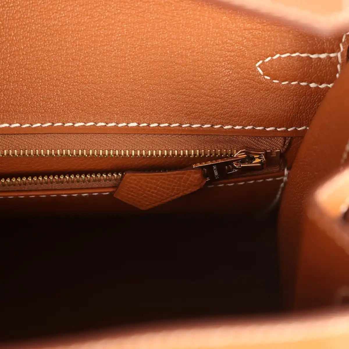 Hermes Birkin Sellier 25 handbag interior close-up of zipper track and leather tab