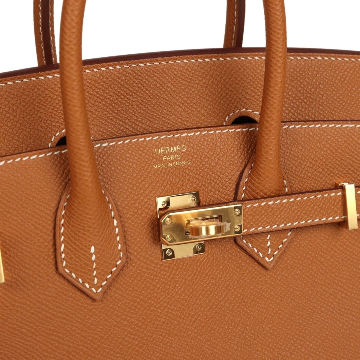 Hermes Birkin Sellier 25 handbag close-up of gold front clasp and tan leather stitching