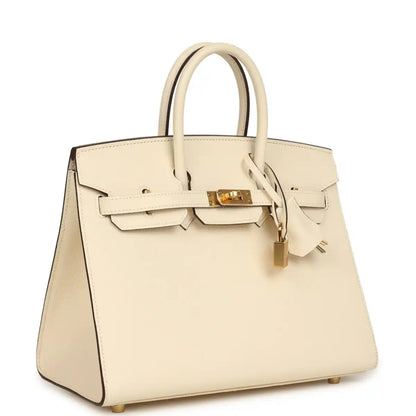 Hermes Birkin Sellier 25 handbag with cream leather body, gold clasp and side profile