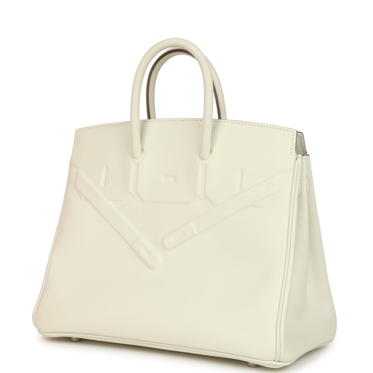 Cream leather handbag with embossed panel and side seam, top handles visible.