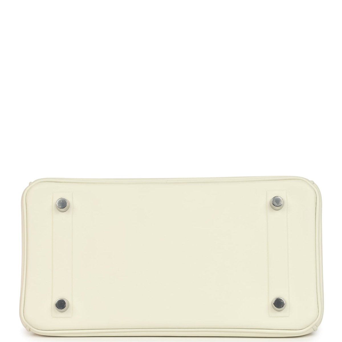 Cream leather handbag base with four metal feet and stitched rectangular bottom.