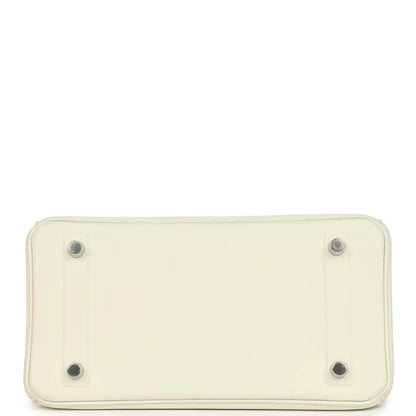 Cream leather handbag base with four metal feet and stitched rectangular bottom.