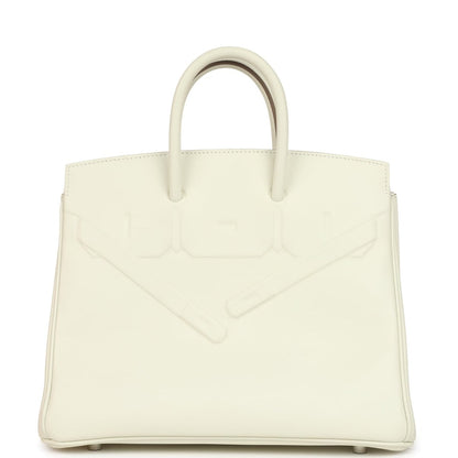 Cream leather structured handbag with embossed detailing and two top handles.