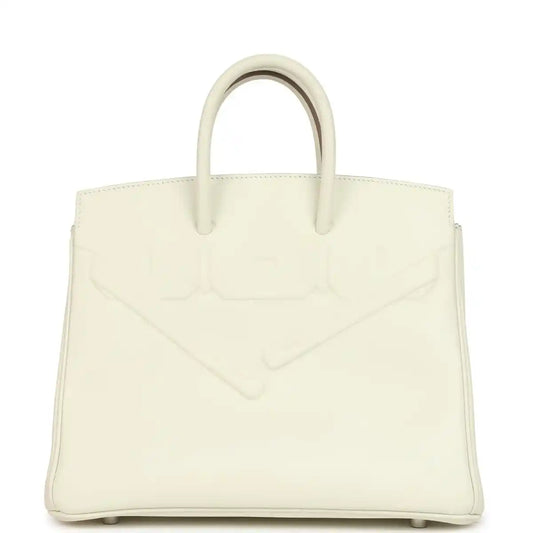 Cream leather structured handbag with embossed detailing and two top handles.