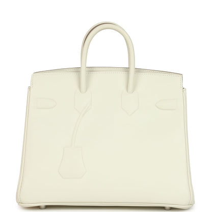 Cream leather handbag with embossed motifs and two top handles, front view.