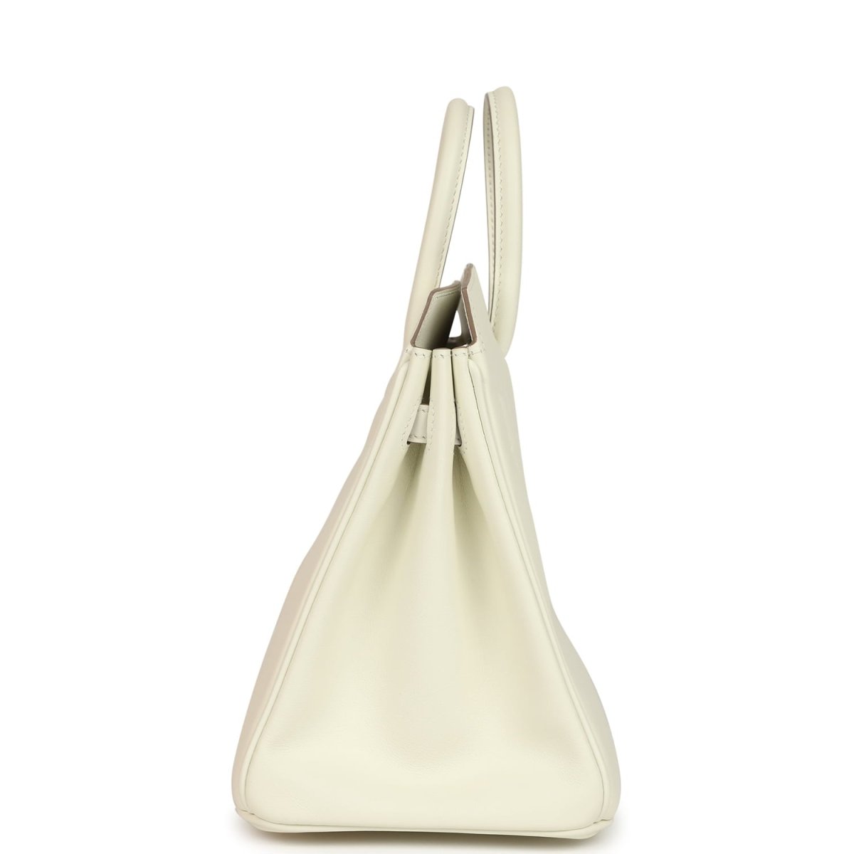 Cream leather handbag with open top showing stitched interior and short handles.
