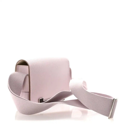 Hermès Geta messenger bag side angle with pale mauve body and adjustable crossbody strap