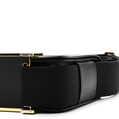 HERMES black leather crossbody bag side view with gold-tone clasp and strap