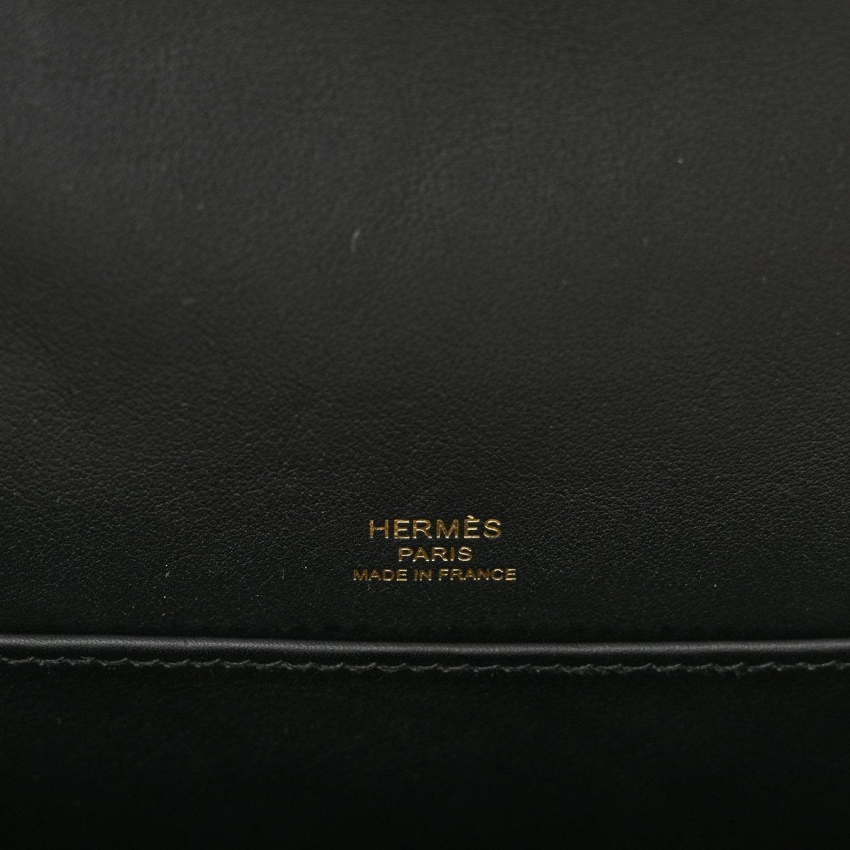 HERMES black leather crossbody bag with embossed “HERMÈS PARIS MADE IN FRANCE”