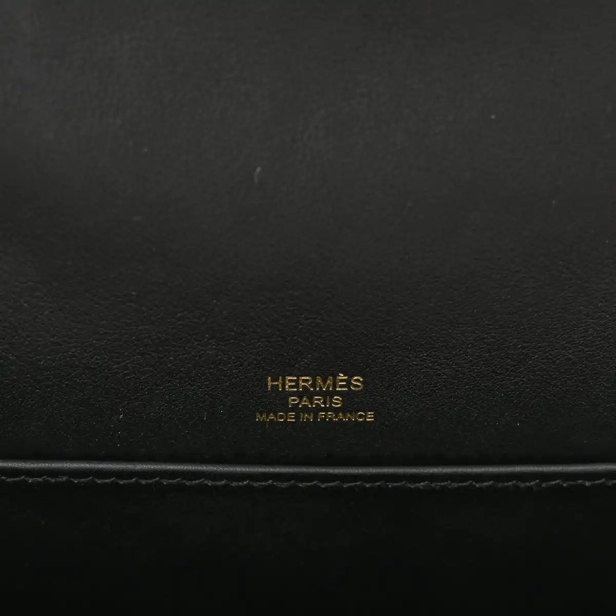 HERMES black leather crossbody bag with embossed “HERMÈS PARIS MADE IN FRANCE”