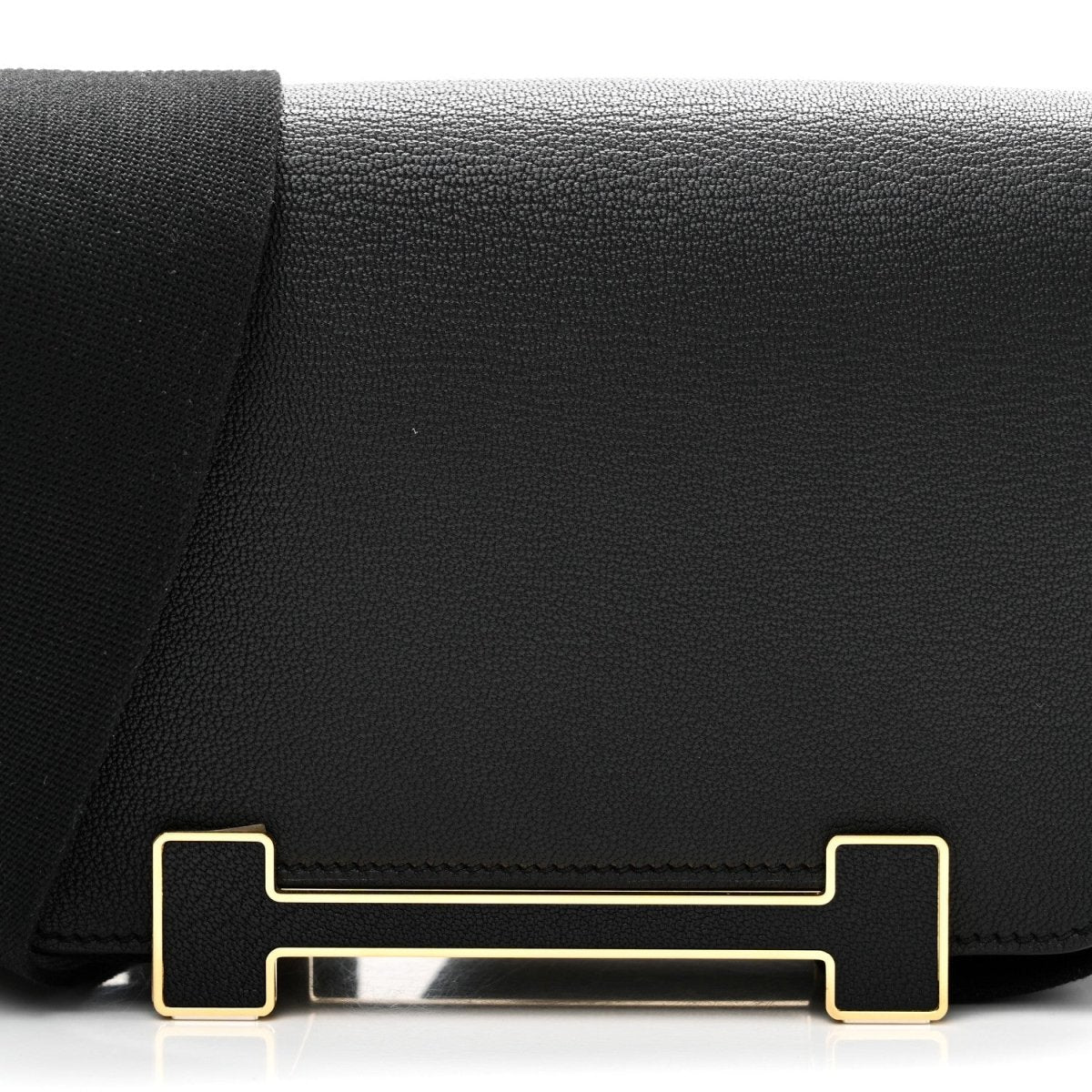 HERMES black leather crossbody bag flap with gold-tone clasp hardware
