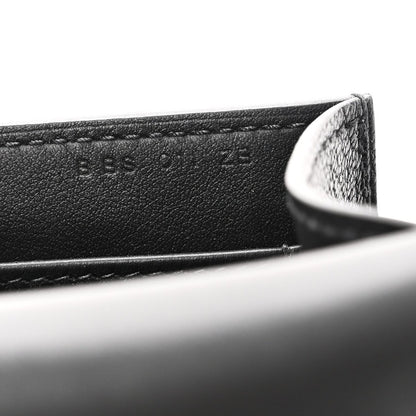 Hermes black leather crossbody bag edge with engraved lettering