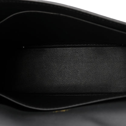 Black leather crossbody bag interior close-up