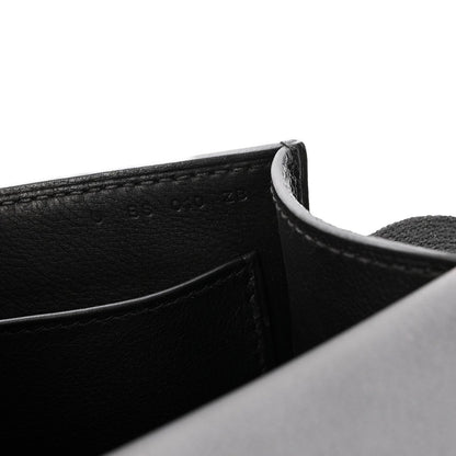 Black leather crossbody bag corner and interior seam detail