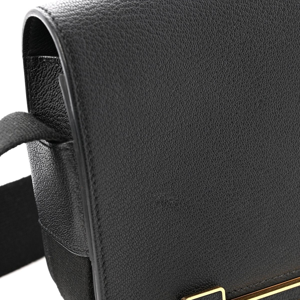 Black leather crossbody bag with fabric strap and gold-tone trim