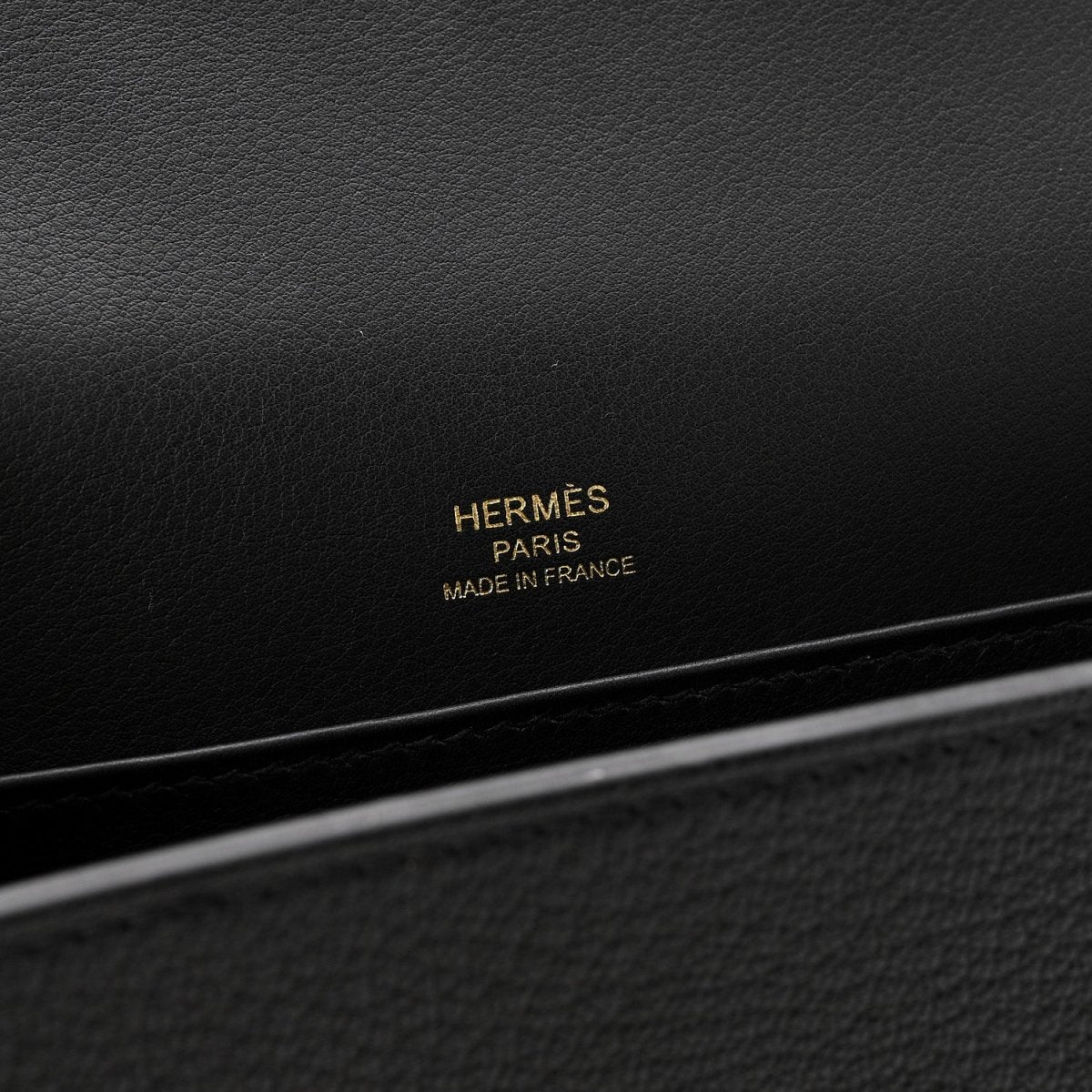 Black leather crossbody bag with HERMÈS Paris Made in France stamp