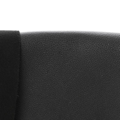 Black leather crossbody bag textured side panel closeup