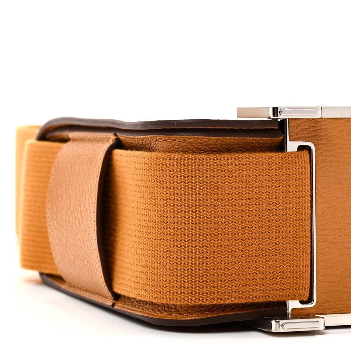 Caramel messenger bag front view with webbing strap pockets and metal buckle closure