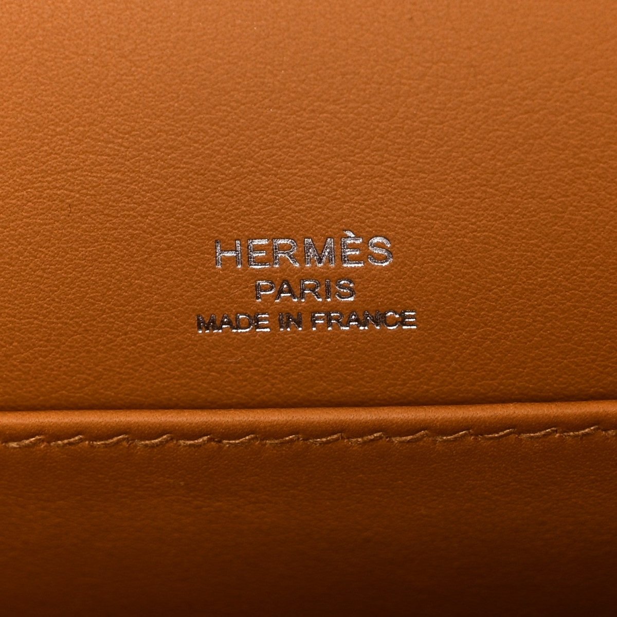 Caramel leather bag panel with “HERMES PARIS MADE IN FRANCE” stamp