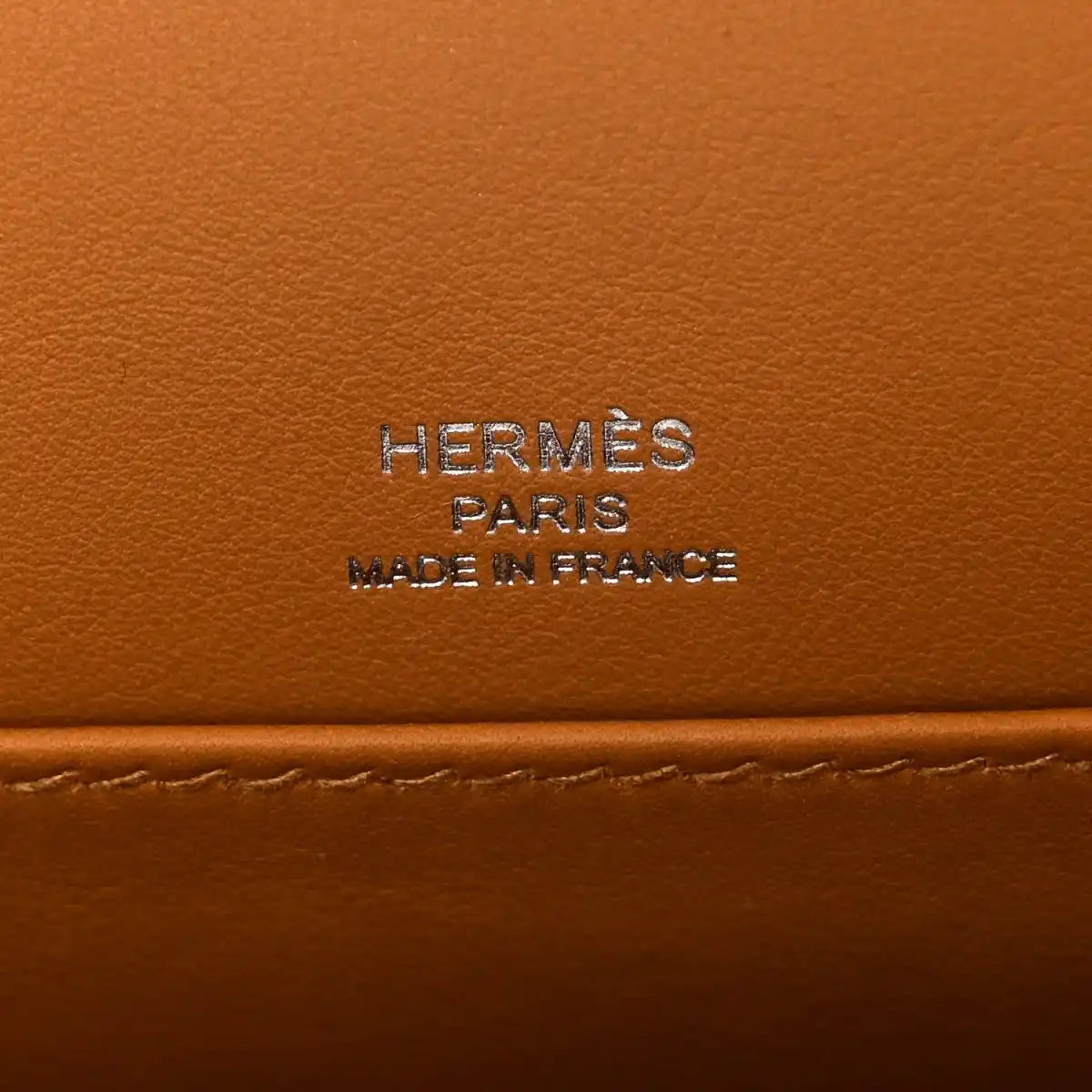 Caramel leather bag panel with “HERMES PARIS MADE IN FRANCE” stamp
