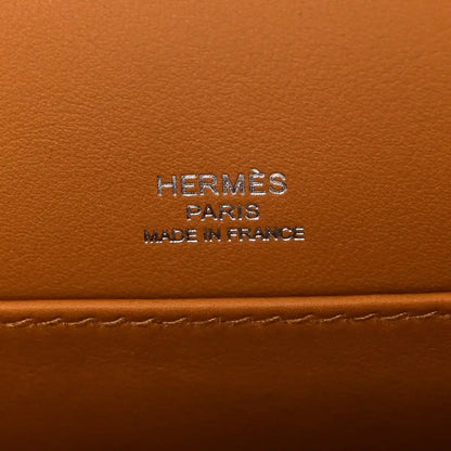 Caramel leather bag panel with “HERMES PARIS MADE IN FRANCE” stamp