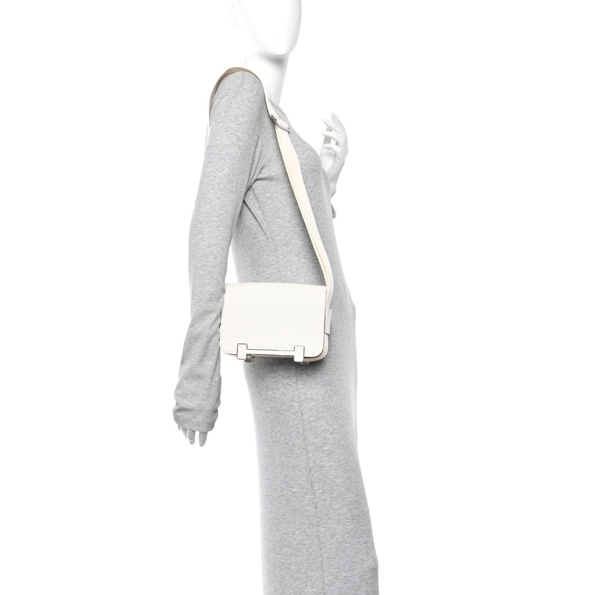 Hermes goatskin crossbody messenger bag with silver-tone front closure on model