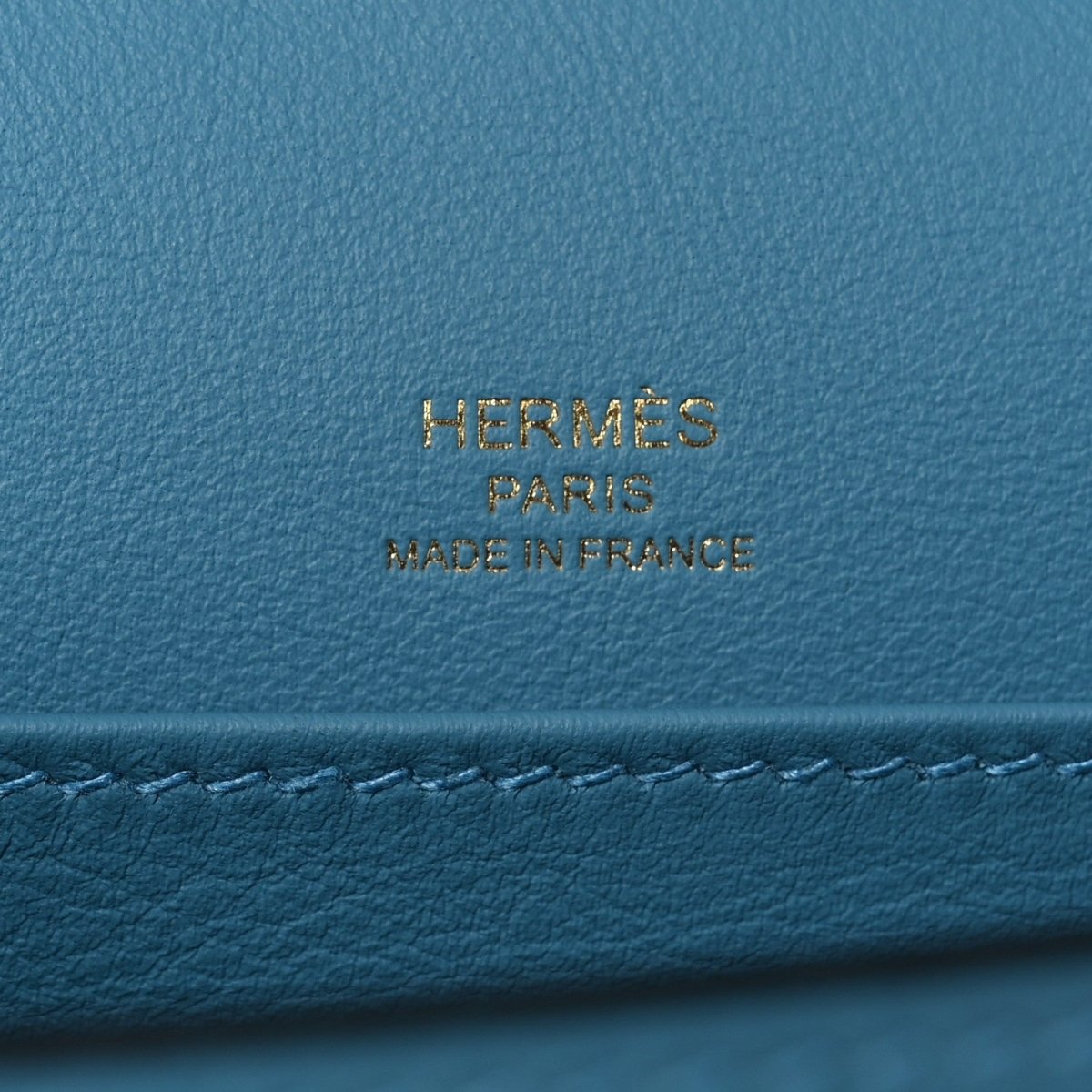 Blue leather bag with gold HERMES PARIS made in France stamp.