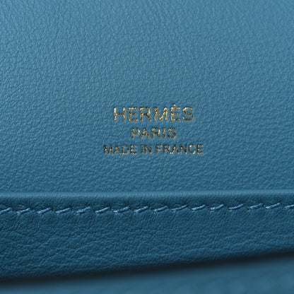 Blue leather bag with gold HERMES PARIS made in France stamp.