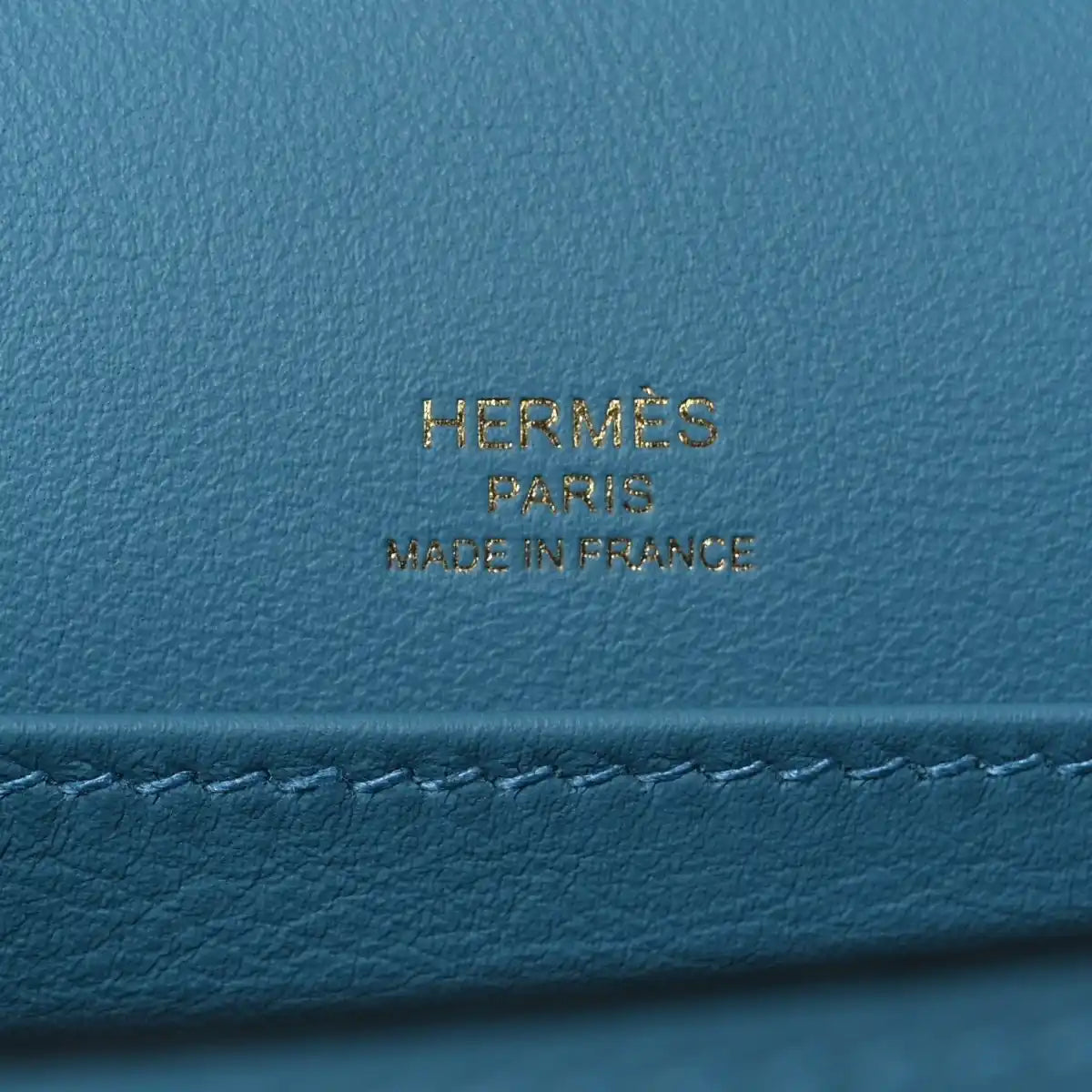 Blue leather bag with gold HERMES PARIS made in France stamp.