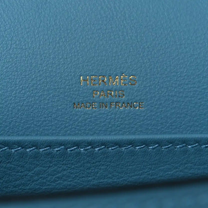 Blue leather bag with gold HERMES PARIS made in France stamp.