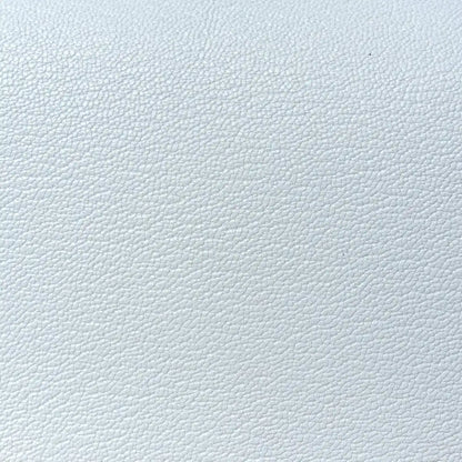 Textured light blue leather surface
