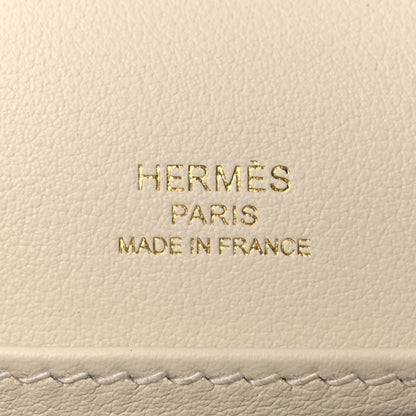 Embossed text on light leather: HERMÈS PARIS MADE IN FRANCE
