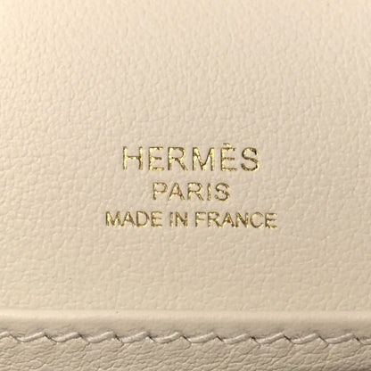 Embossed text on light leather: HERMÈS PARIS MADE IN FRANCE