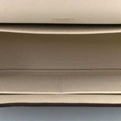 Light leather crossbody lining seam and stitching detail