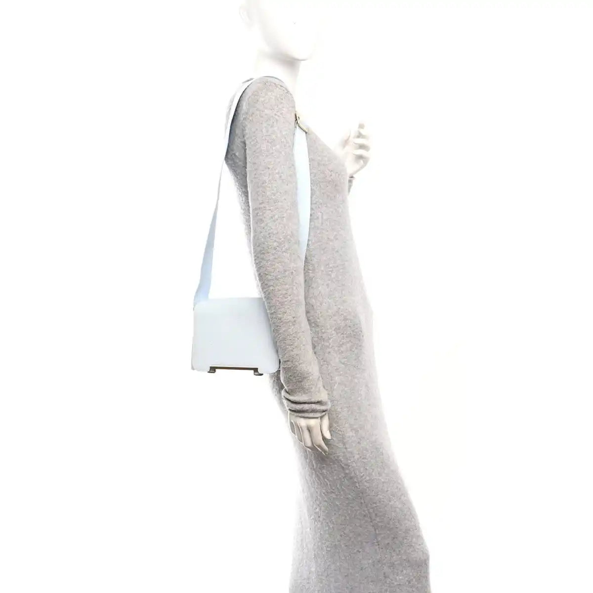 Light blue leather crossbody strap with grey underside and metal hardware