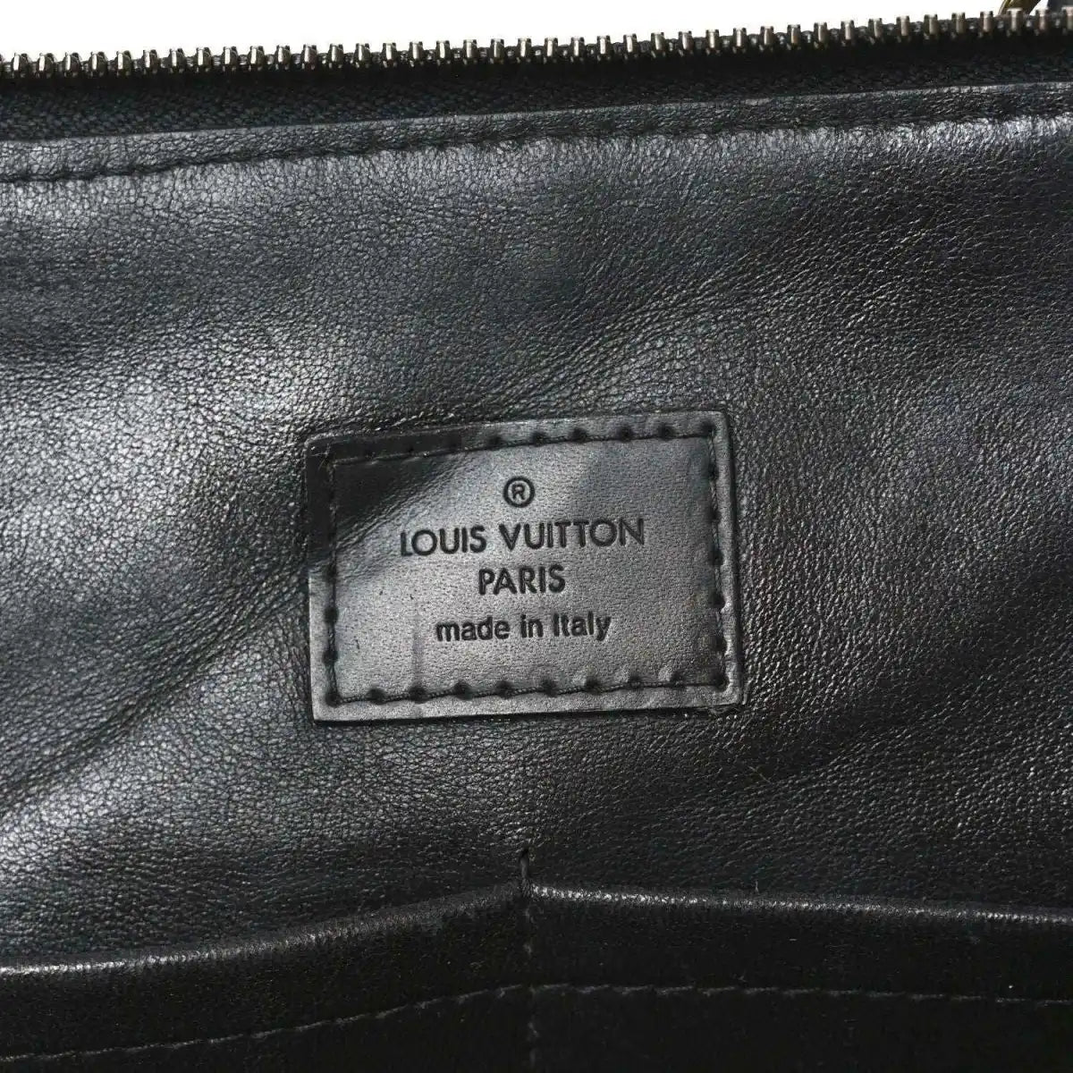 Louis Vuitton Paris label on black leather interior