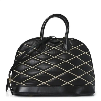 Black quilted lambskin Alma PM handbag with top handles and gold-tone hardware