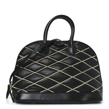 Black quilted lambskin Alma PM handbag with top handles and gold-tone hardware