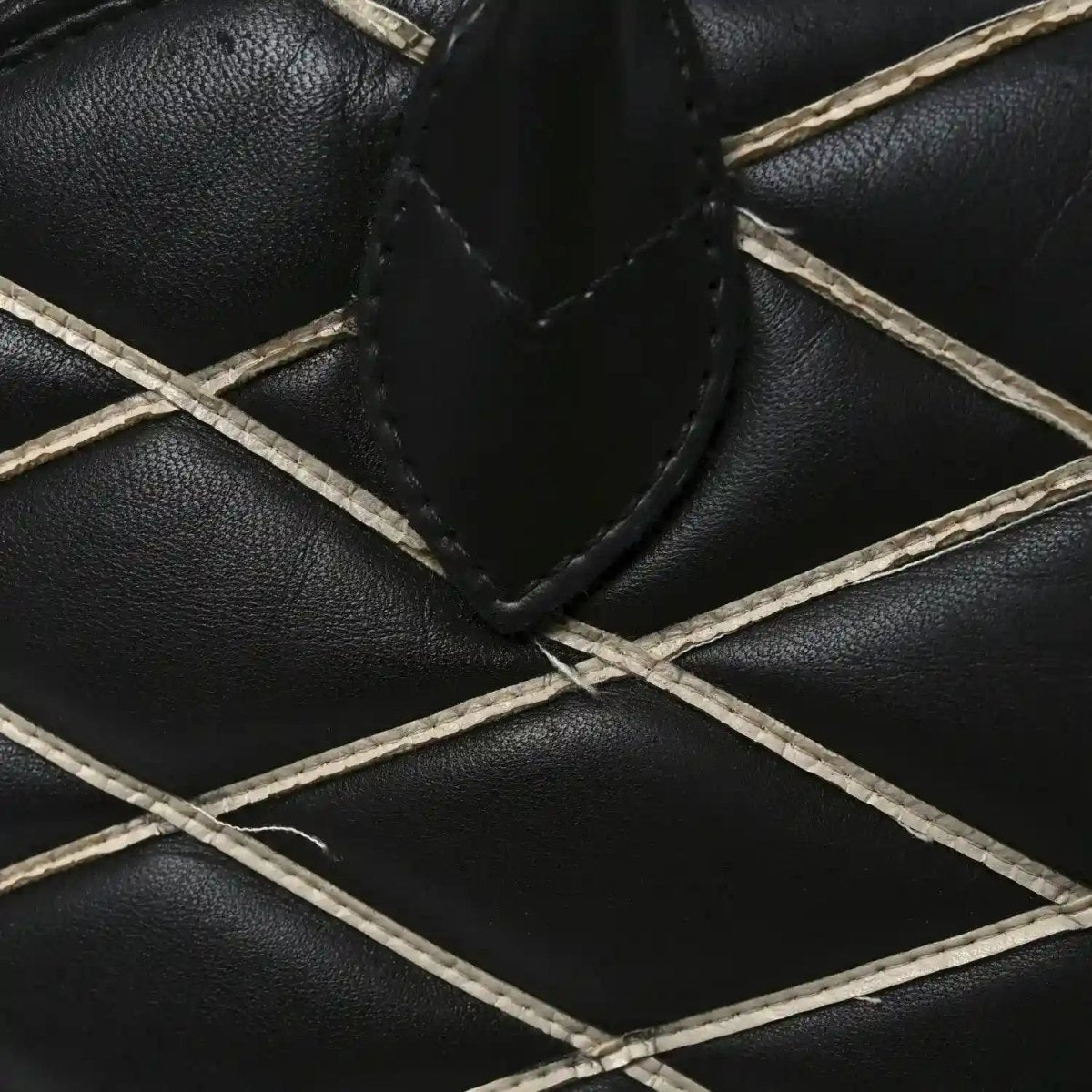 Black quilted lambskin lattice with white leather trim stitching