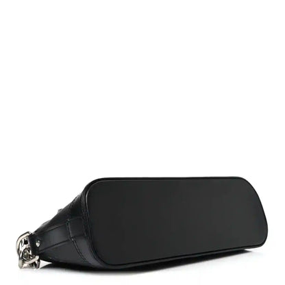 Black Louis Vuitton Alma monogram handbag with rounded body and smooth front