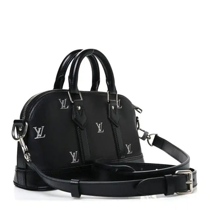Black Louis Vuitton Alma monogram handbag with top handles and adjustable strap