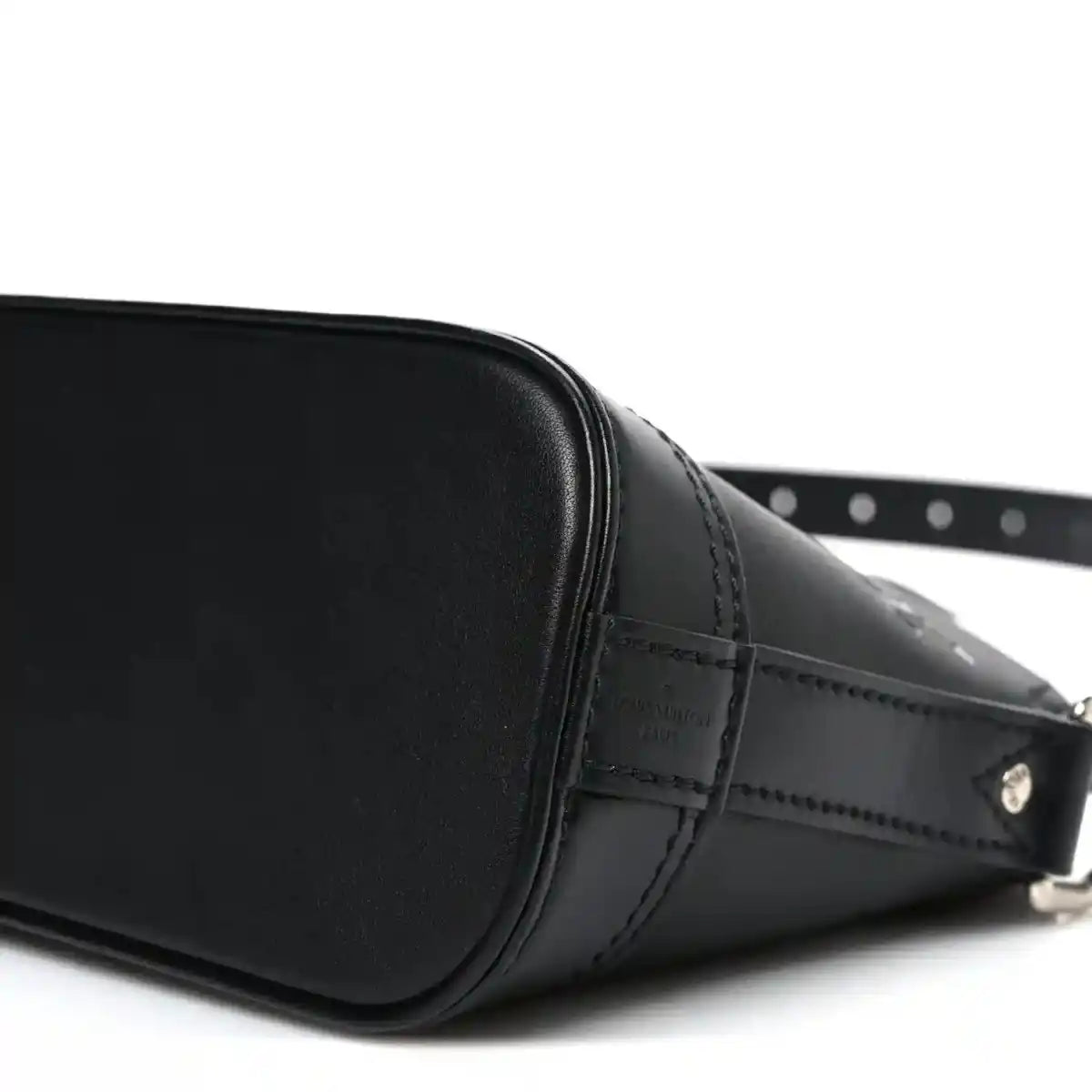 Black Louis Vuitton Alma monogram handbag side view with metal buckle and stitching
