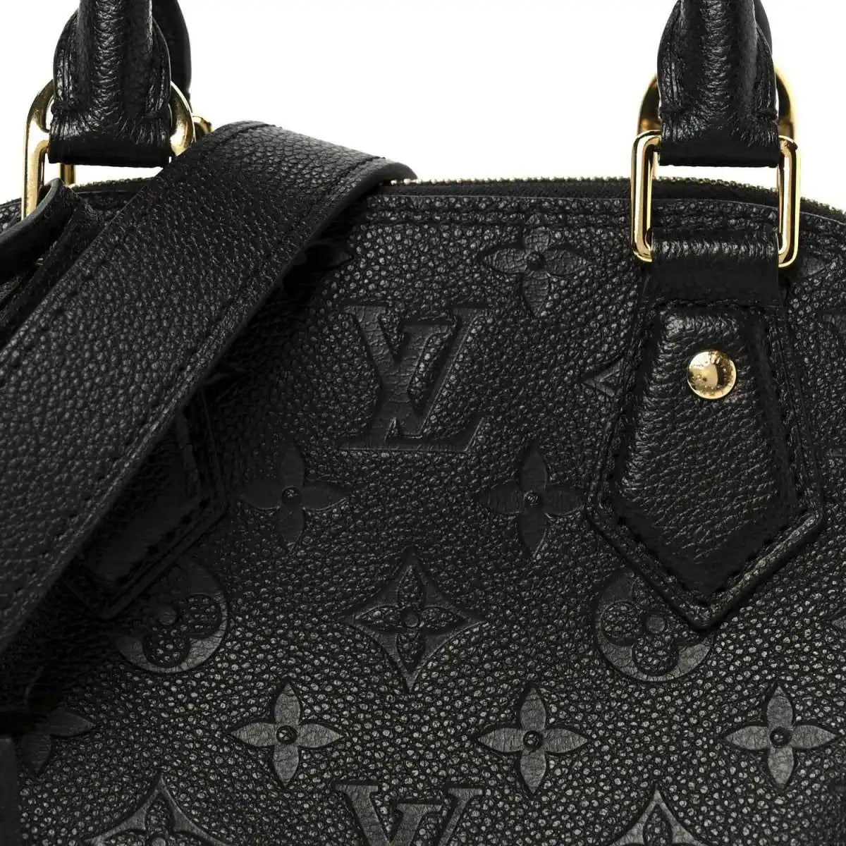 Black embossed monogram leather panel with stitched edges near handle
